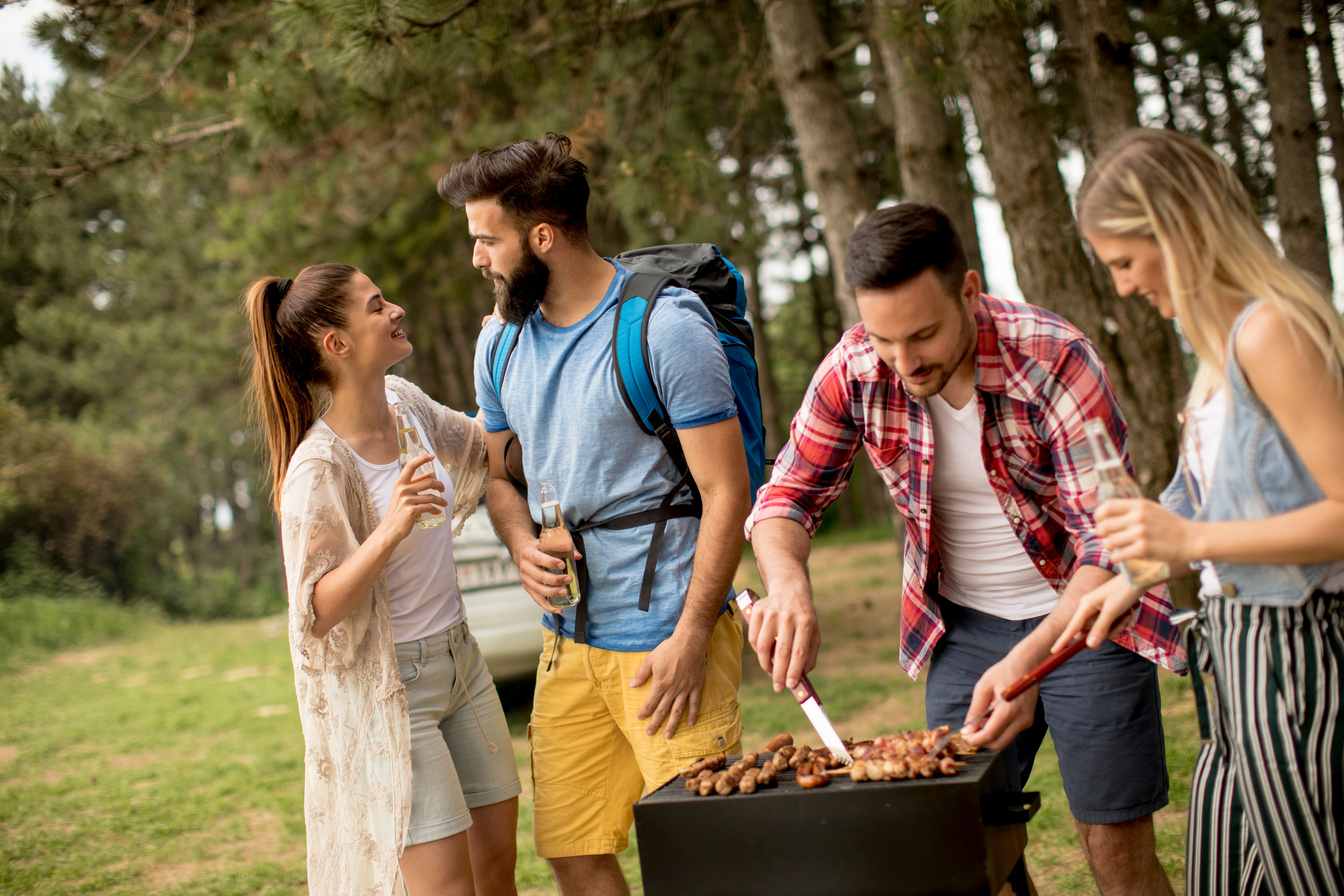 Young People Enjoying Barbecue 